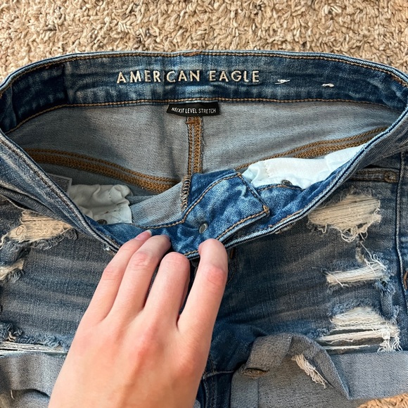 American Eagle Ne(x)t Level Stretch Medium Wash Denim Distressed Shorts - Picture 6 of 8